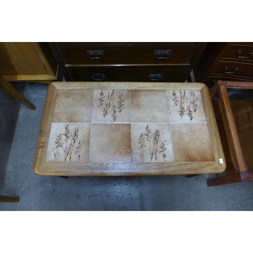 181 - A teak and tiled top coffee table and another