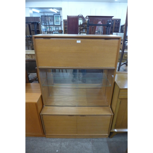 185 - A teak display cabinet