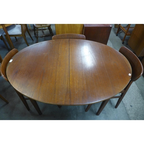 191 - A teak extending dining table and four chairs