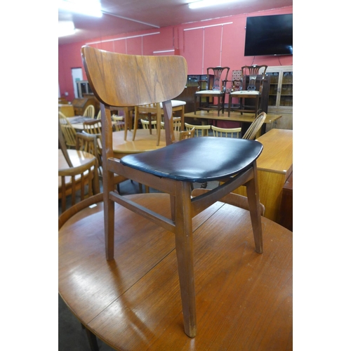 191 - A teak extending dining table and four chairs