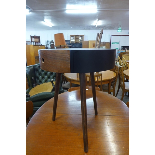 198 - A teak and black lacquered circular occasional table