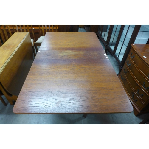 203 - A teak drop-leaf table