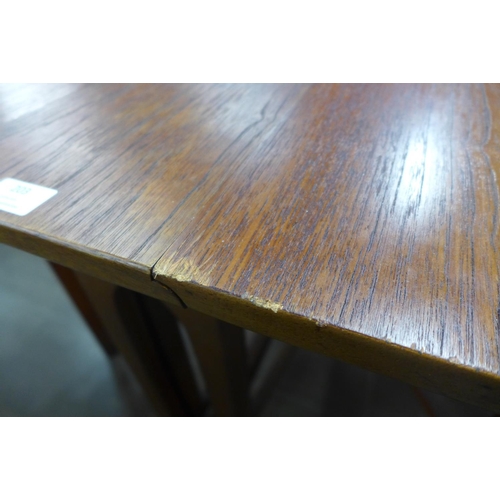 203 - A teak drop-leaf table