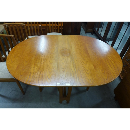 204 - A teak drop-leaf table and four chairs