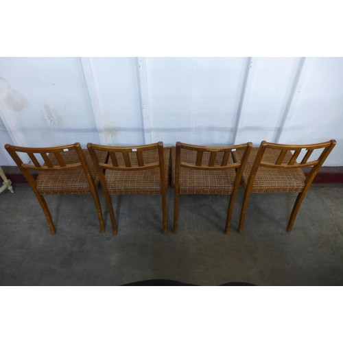 218 - A set of four teak dining chairs