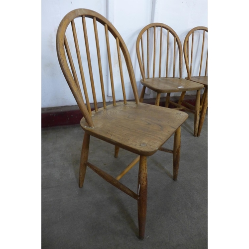 219 - A set of four Ercol Blonde Windsor elm and beech chairs, a/f