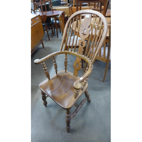 230 - An elm and beech Windsor armchairs