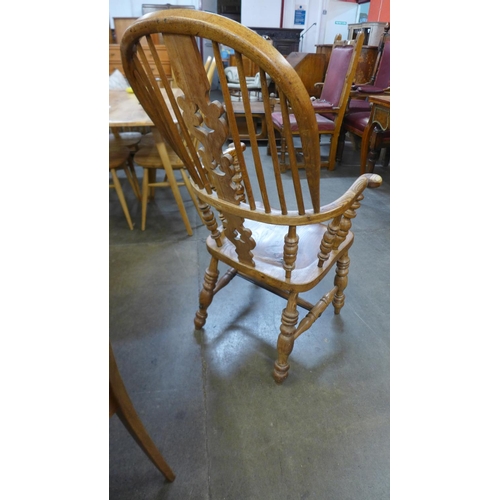 230 - An elm and beech Windsor armchairs