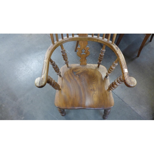 230 - An elm and beech Windsor armchairs