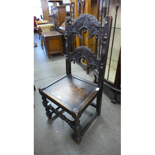 234 - A Carolean style carved oak side chair