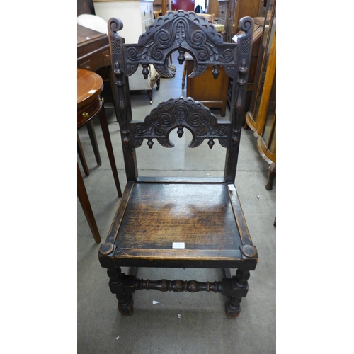 234 - A Carolean style carved oak side chair