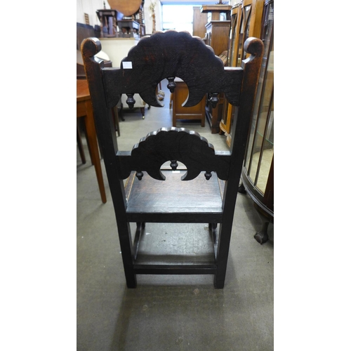 234 - A Carolean style carved oak side chair