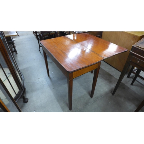 236 - A Regency inlaid mahogany rectangular fold over tea table