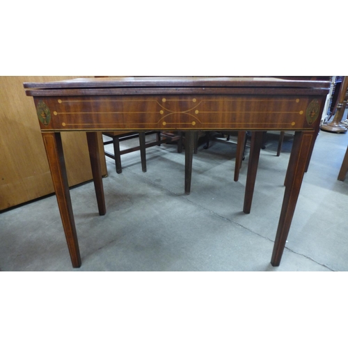 236 - A Regency inlaid mahogany rectangular fold over tea table