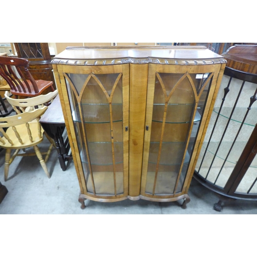 257 - A walnut two door display cabinet