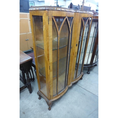 257 - A walnut two door display cabinet