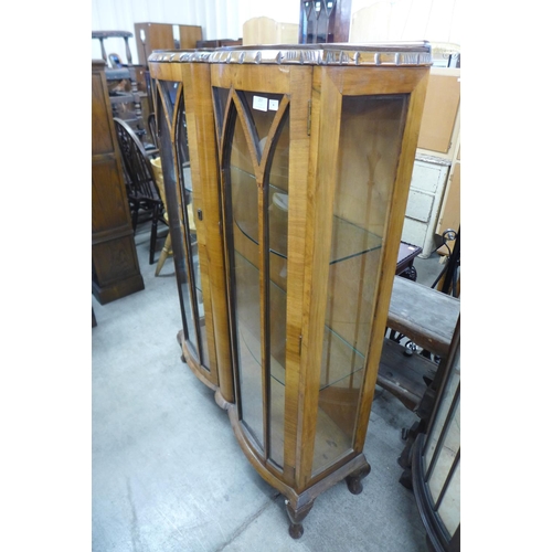 257 - A walnut two door display cabinet