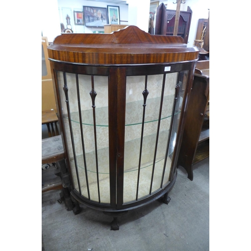 258 - A mahogany bow front display cabinets