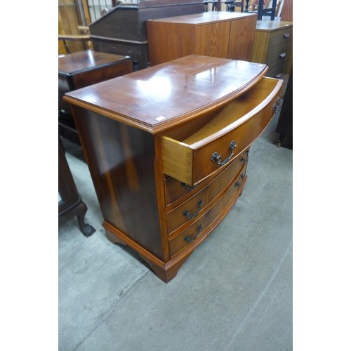 275f - A yew wood bow front chest of drawers