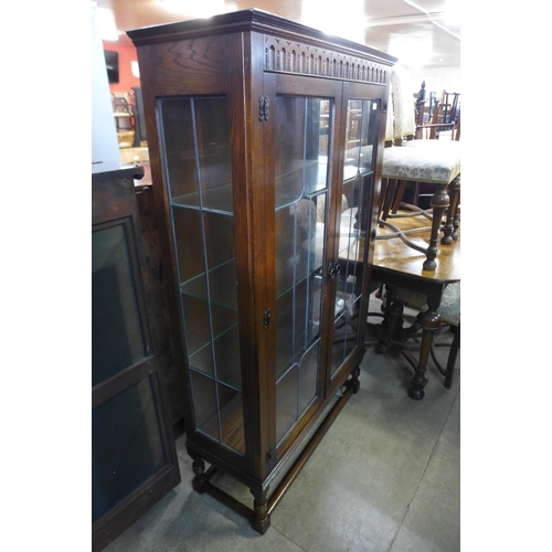 279 - An oak two door display cabinet