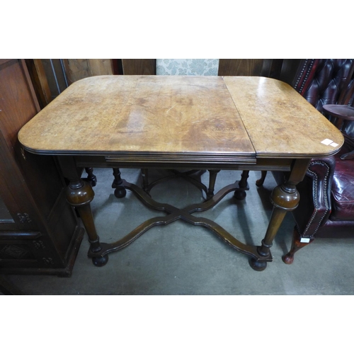 280 - A Queen Anne style burr walnut extending dining table and four chairs