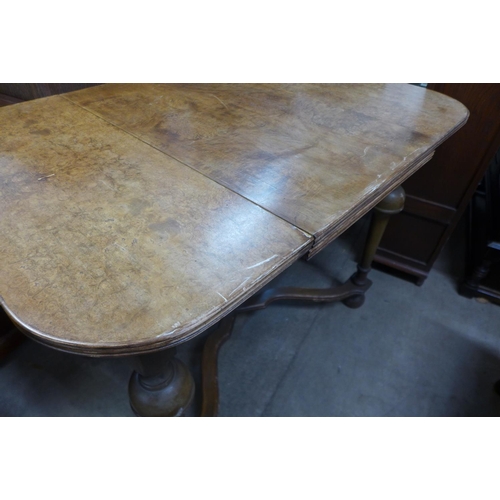 280 - A Queen Anne style burr walnut extending dining table and four chairs