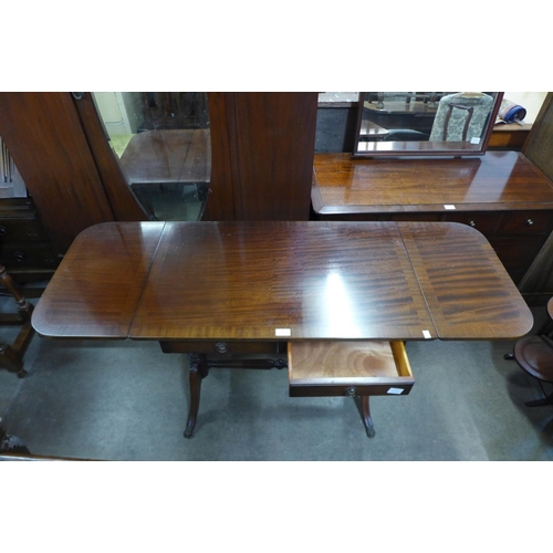 283 - A set of three oak dining chairs and a mahogany drop-leaf sofa table