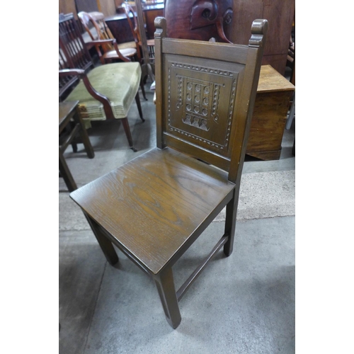 288 - An oak refectory table and eight chairs