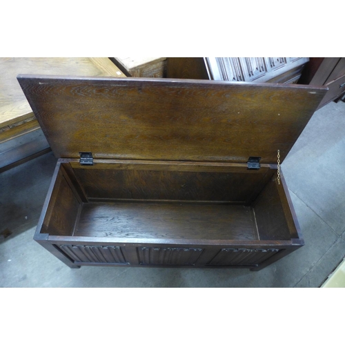 290 - An oak linenfold blanket box