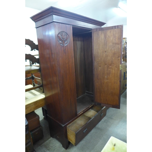 292 - An Arts and Crafts mahogany wardrobe