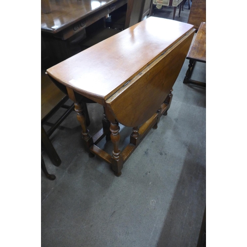 294 - An oak gateleg table and an oak coffee table