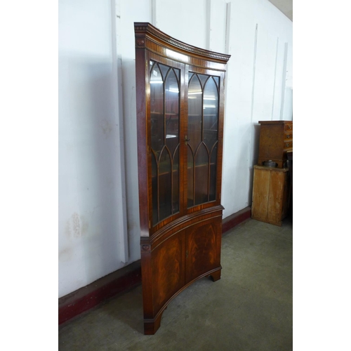 296a - A mahogany freestanding concave corner cabinet