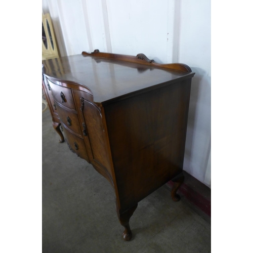 296e - A walnut serpentine sideboard