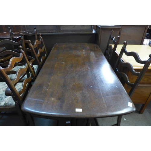 298 - An Ercol Old Colonial dark elm refectory table and six ladderback chairs - with lot 295