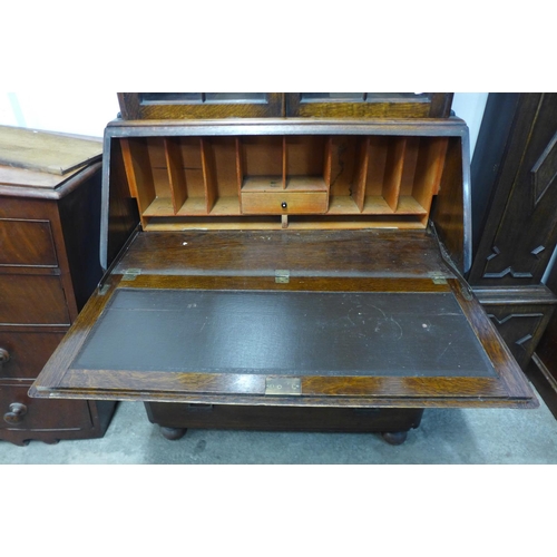 299 - An oak bureau bookcase