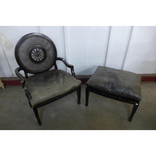 304 - A French style ebonised bergere library chair and matching stool