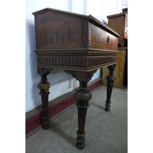 306 - A 19th Century French carved fruitwood writing desk (signs of old woodworm)