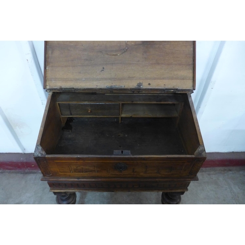 306 - A 19th Century French carved fruitwood writing desk (signs of old woodworm)