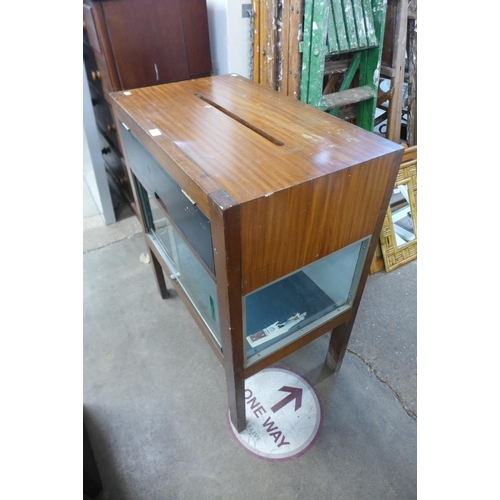 310 - A teak slot display cabinet and four teak dining chairs