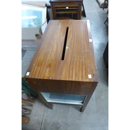 310 - A teak slot display cabinet and four teak dining chairs