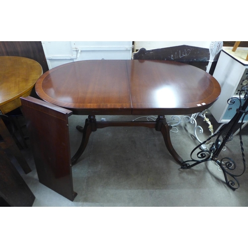 321 - A teak chest of drawers, a/f and a mahogany dining table