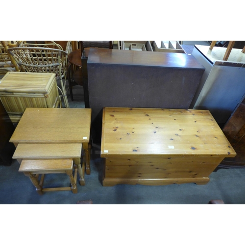 336 - A pine blanket box and an oak nest of tables