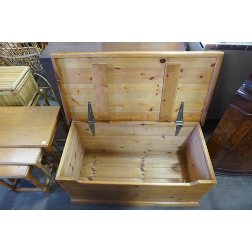 336 - A pine blanket box and an oak nest of tables