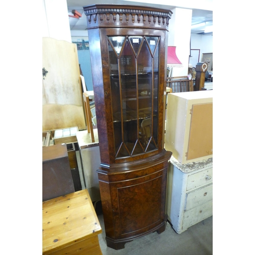 337 - A burr walnut freestanding corner cabinet