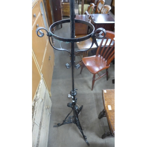 351 - A Victorian wrought iron telescopic standard lamp