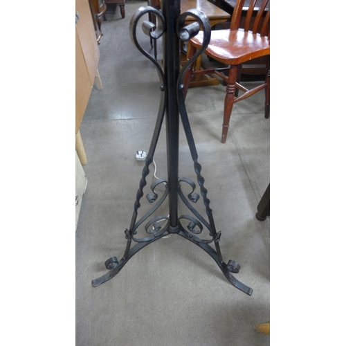 351 - A Victorian wrought iron telescopic standard lamp