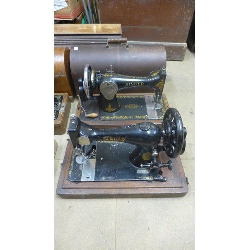 372 - Two cased Singer sewing machines and two others