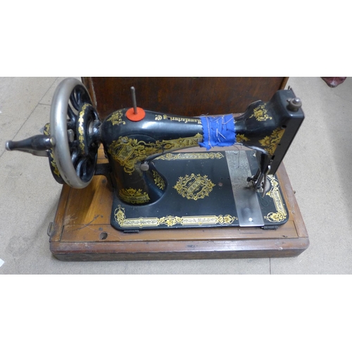 390 - A cased Singer sewing machine