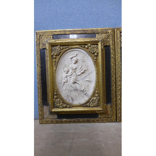 398 - A pair of faux marble relief plaques, manner of J.P Darbien, framed