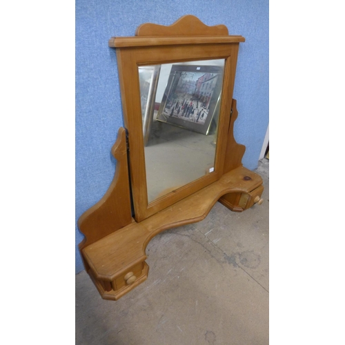 436 - A pine dressing table mirror and a bamboo mirror